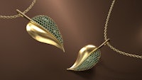 two gold leaf necklaces with emerald stones